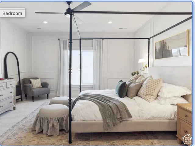 Bedroom featuring wall molding, neutral carpeting, recessed lighting, and a metal-finish ceiling fan with integrated lighting
