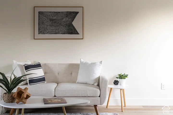 Neutral interior space featuring wood-finish flooring and a minimalist aesthetic