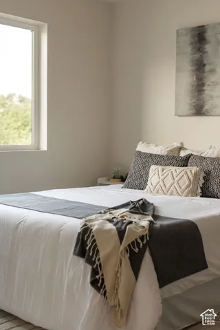 Neutral wall palette, high-profile vertical window, and crisp architectural finishes