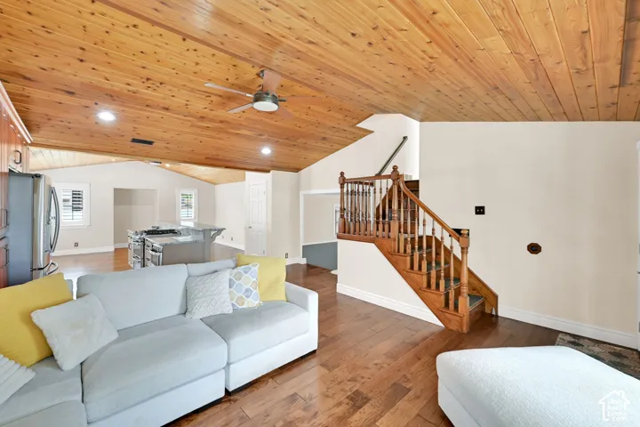 Vaulted wood-paneled ceiling with recessed lighting and a ceiling fan