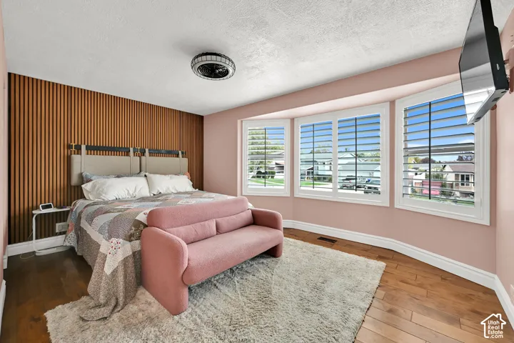 Wood-finish flooring with a textured area rug