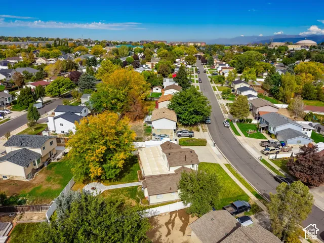 Expansive neighborhood setting with mature trees and established residential properties