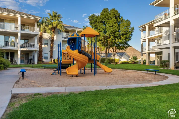 Playground: A playground set on the lawn between the buildings.