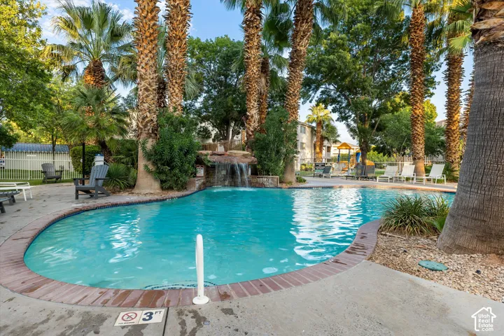 Pool: The waterfall pool, with a shallow entry and lounge seating all around.