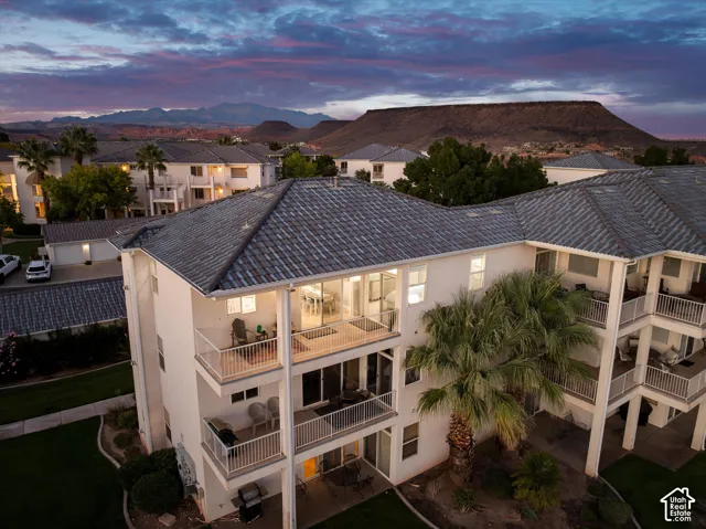 Aerial: Covered decks face Red Bluff and the surrounding ridges at twilight.