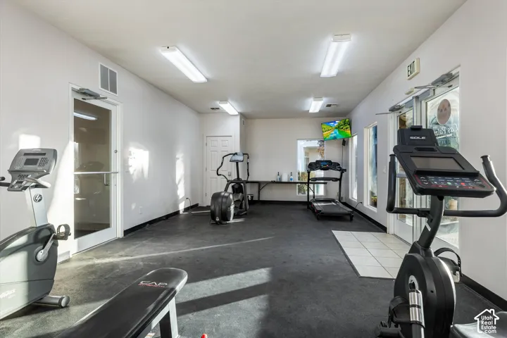 Fitness Center: Cardio machines and a weight bench in the full fitness center.