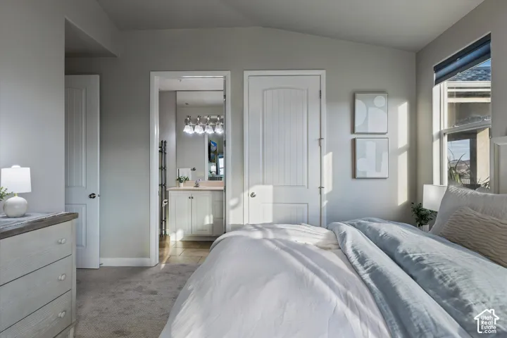 Primary Bedroom: The primary suite opens to its own bathroom and a walk-in closet.