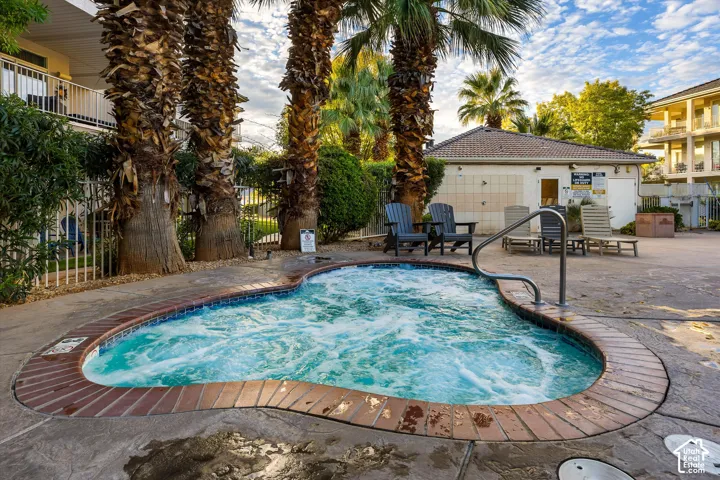 Hot Tub: One of two hot tubs, shaded by tall palms.