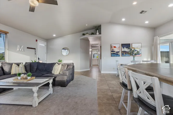 Living Room: The open living area flows toward the entry and the hallway to the bedrooms.