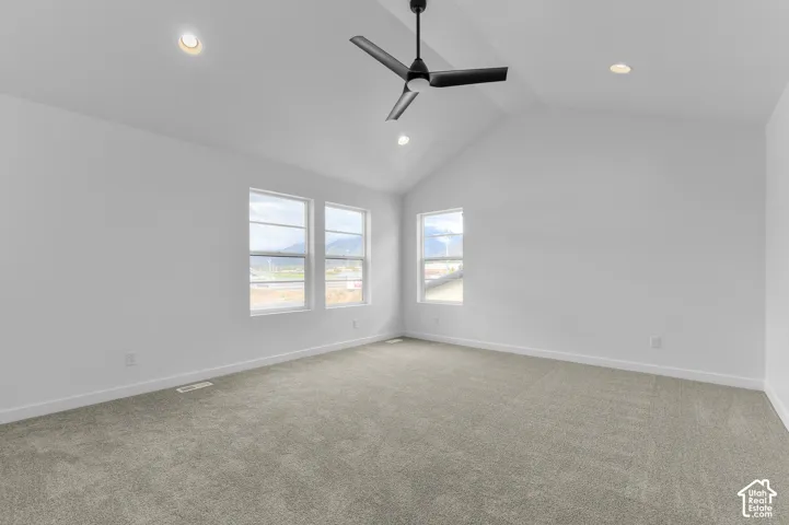 Vaulted ceiling with a matte black three-blade ceiling fan, recessed lighting, and wall-to-wall carpeting