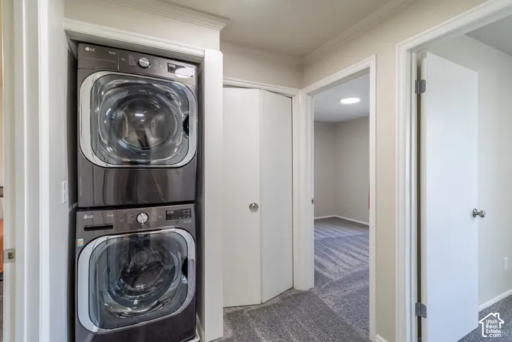 Stackable washer and dryer appliances within a dedicated alcove