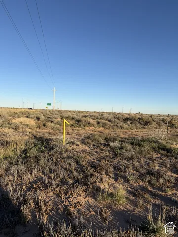 Expansive vacant land featuring natural desert terrain and native vegetation