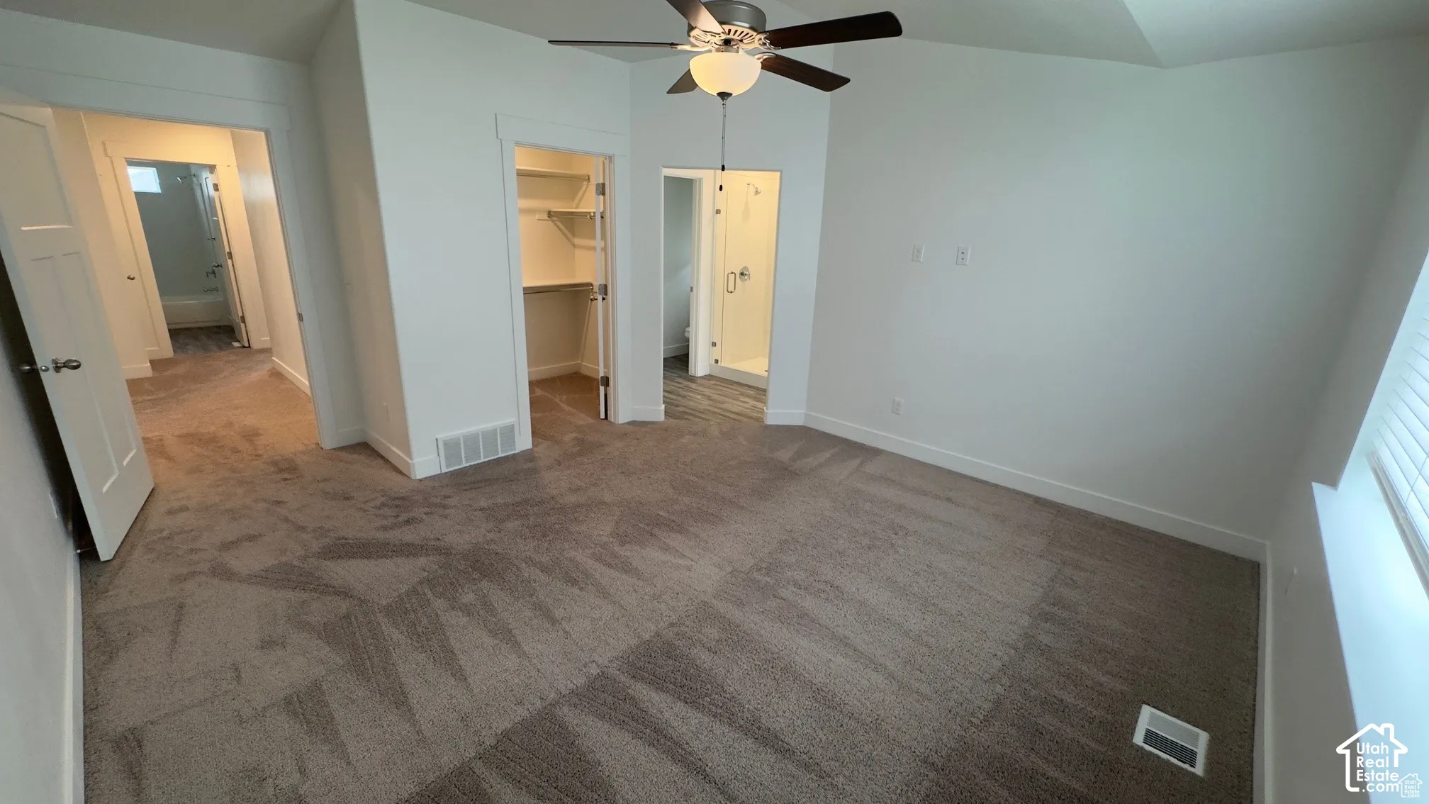 Vaulted ceiling with a ceiling fan