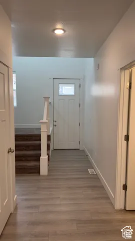Wood-finish flooring throughout the entryway