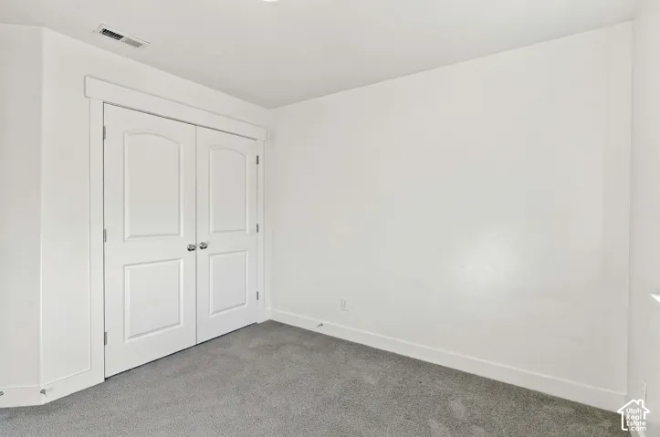 White paneled double doors with arched top lites