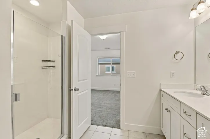 Primary Bath Walk-in shower with clear glass enclosure and integrated shelving