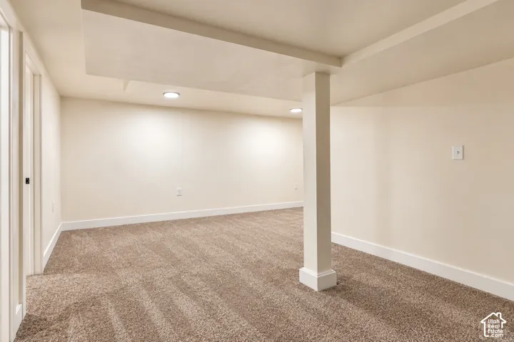 Neutral-toned wall finish, wall-to-wall carpeting, and recessed ceiling lighting