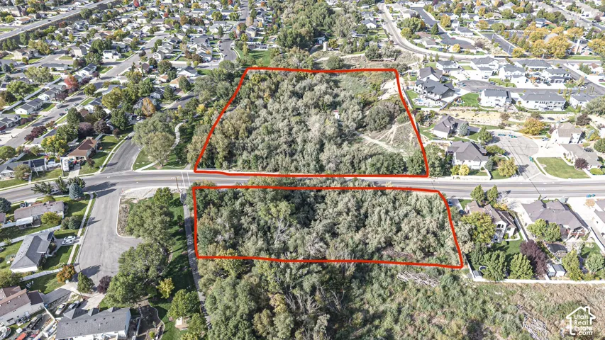 Dual-parcel land opportunity featuring mature tree coverage and established site boundaries