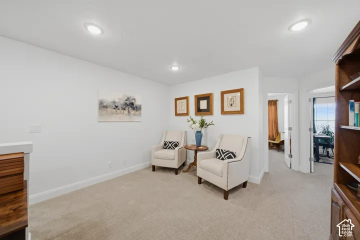 Neutral interior space featuring recessed lighting and wall-to-wall carpeting