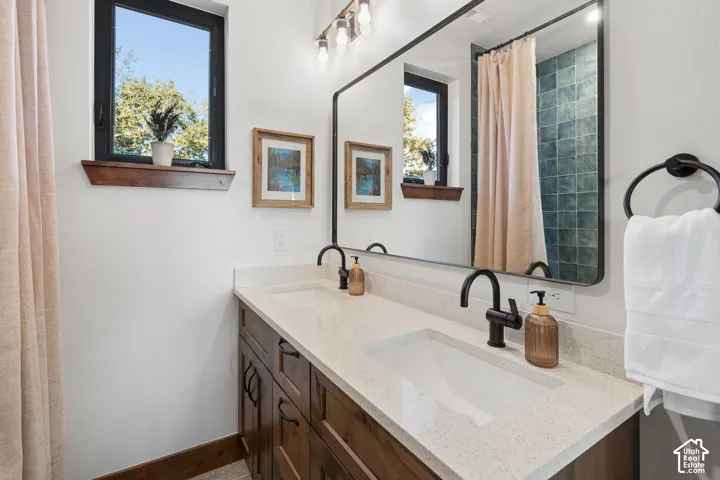 Double vanity with integrated rectangular sinks and quartz countertops
