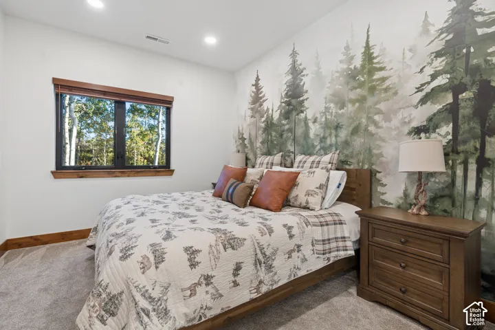Accent wall featuring a detailed tree mural