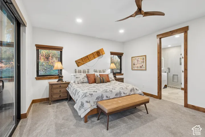 Recessed lighting, ceiling fan, wood-finish trim and door frame, carpeted flooring, and a sliding glass door
