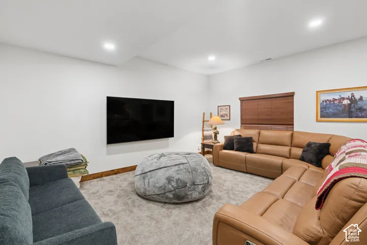 Recessed ceiling lighting, white walls, and wood-finish trim create a bright atmosphere