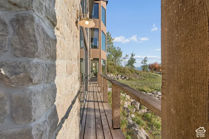 Stone exterior wall with a wall-mounted light fixture