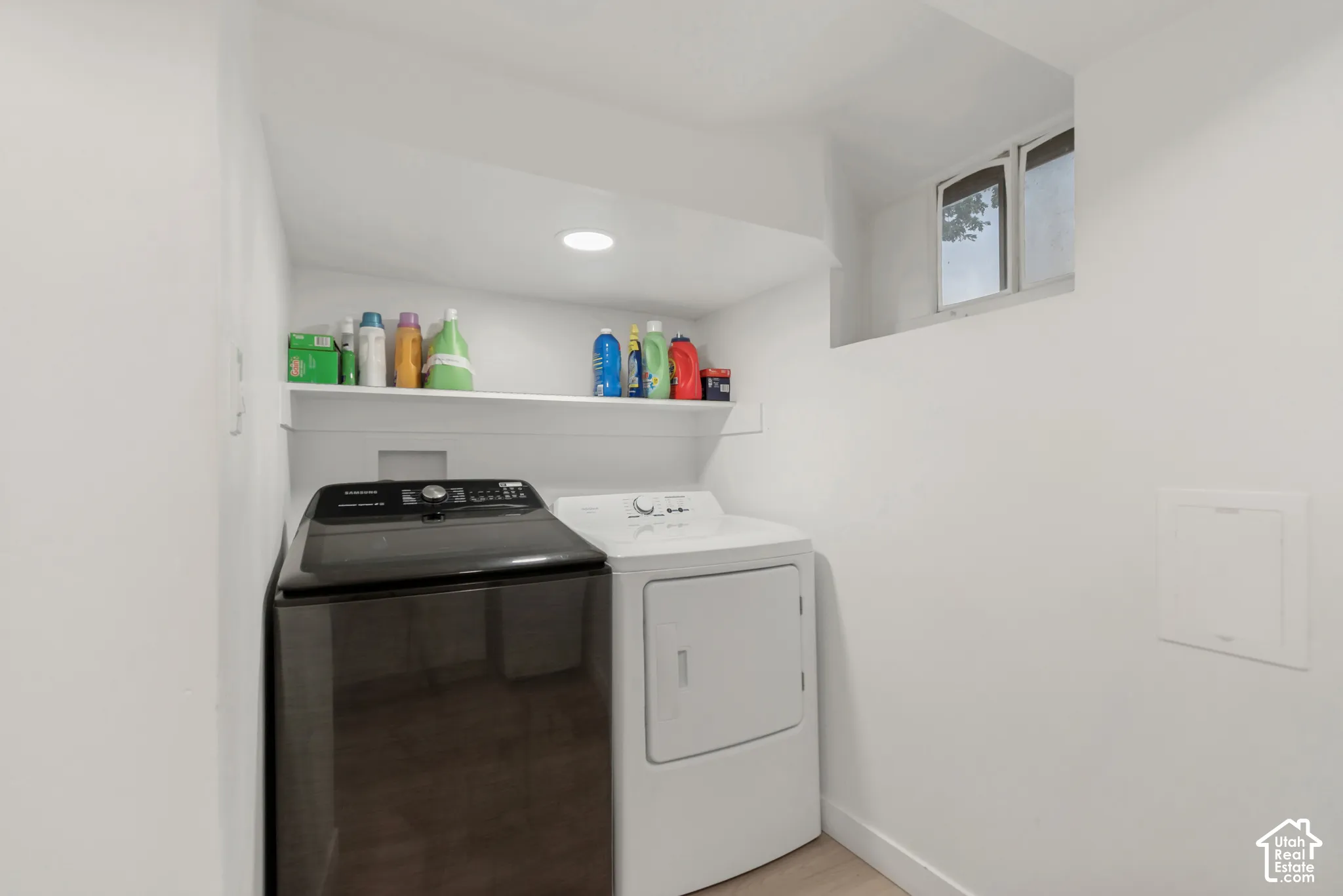 Laundry area featuring recessed ceiling lighting, a built-in wall shelf, and a rectangular window