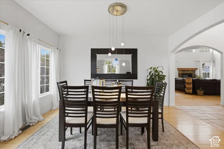 Multi-light pendant fixture, grid-patterned windows, and arched entryway