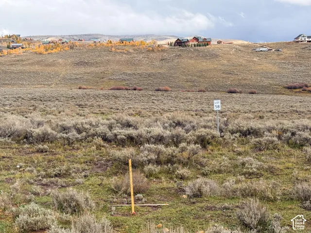 Expansive undeveloped land parcel featuring native high-desert vegetation and mountain terrain