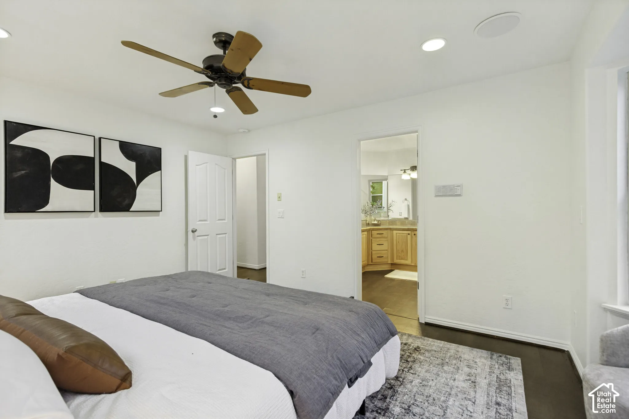 Room featuring wood-finish flooring, a ceiling fan with integrated lighting, and recessed ceiling lighting