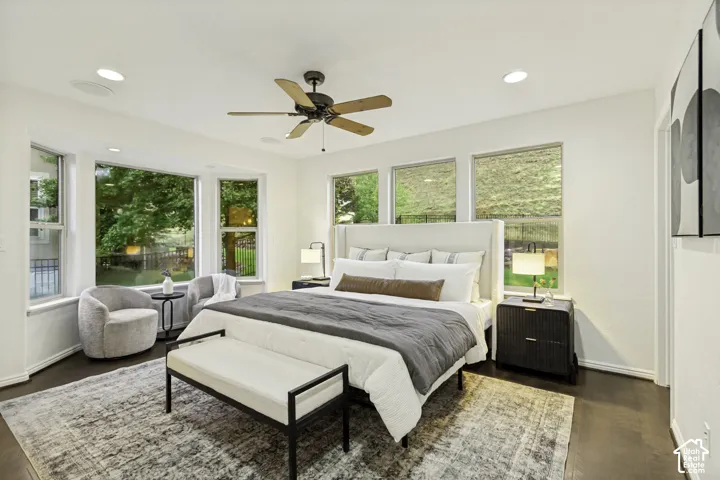 Bedroom featuring wood-finish flooring, recessed lighting, a ceiling fan, and multiple large windows