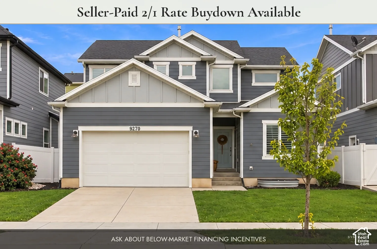 Two-story residence featuring horizontal lap siding, a front-facing attached two-car garage, multiple gables, and a concrete driveway. This image has been digitally altered to remove dumpsters and a vehicle from view. Real-time conditions may vary.