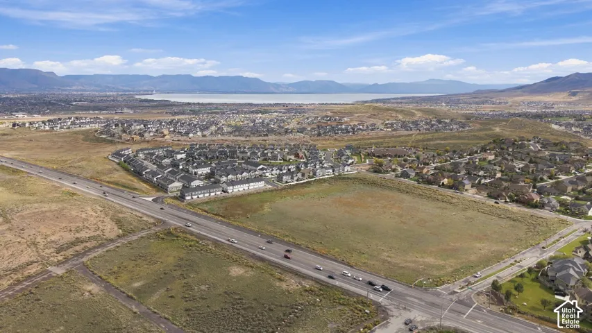 Aerial perspective featuring expansive land with mountain and lake terrain
