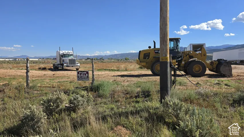Expansive undeveloped acreage featuring native desert vegetation and mountain backdrop