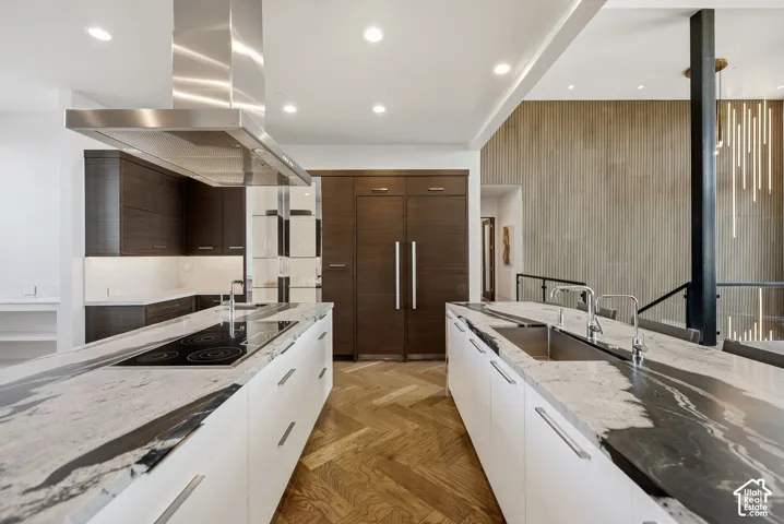 Kitchen with Double islands, thermadore appliances. Grantie couters resembling Brazilian Copacabana Granite with a suede finish