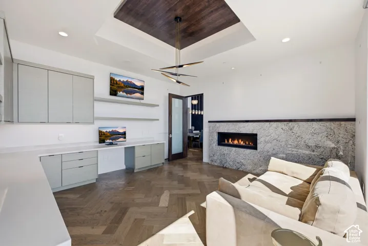 Office space on main level with patio access and fireplace.