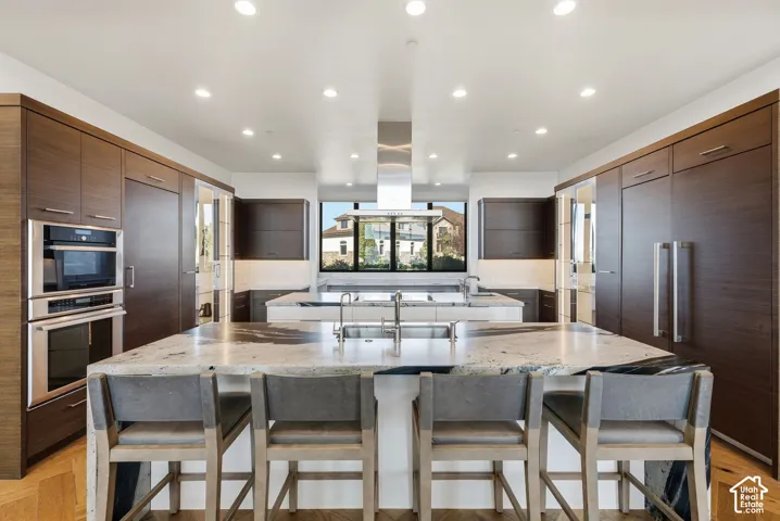 Kitchen with Double islands, thermadore appliances. Grantie couters resembling Brazilian Copacabana Granite with a suede finish