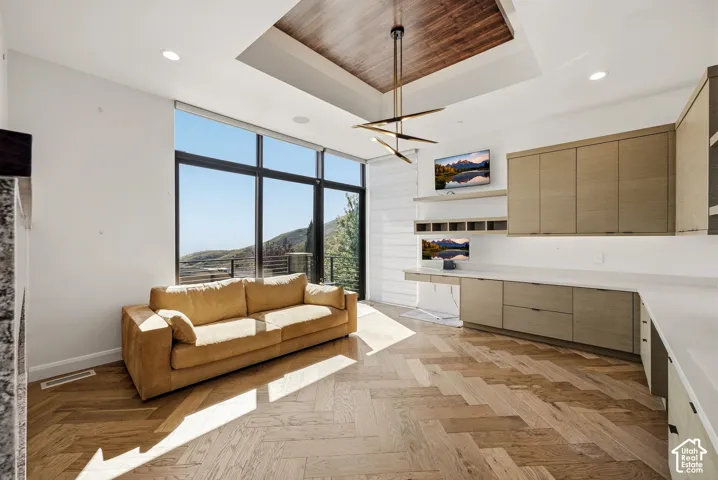 Office space on main level with patio access and fireplace.