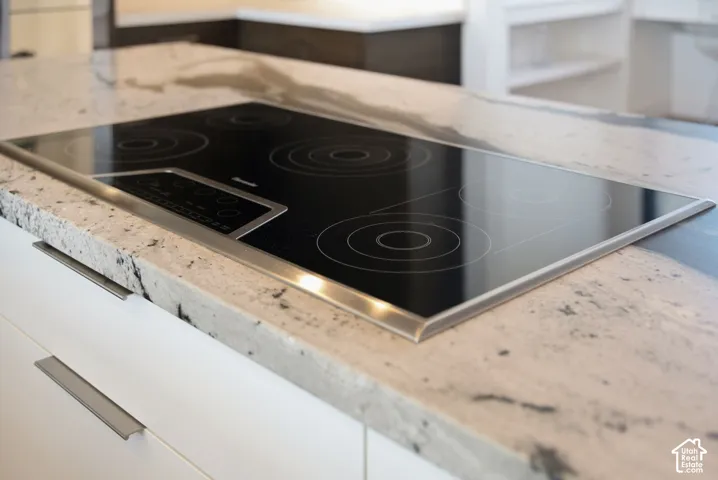 Kitchen with Double islands, thermadore appliances. Grantie couters resembling Brazilian Copacabana Granite with a suede finish