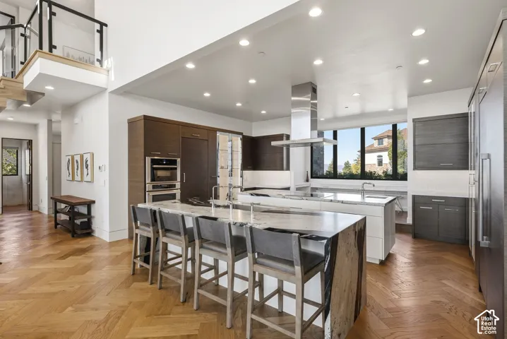 Kitchen with Double islands, thermadore appliances. Grantie couters resembling Brazilian Copacabana Granite with a suede finish