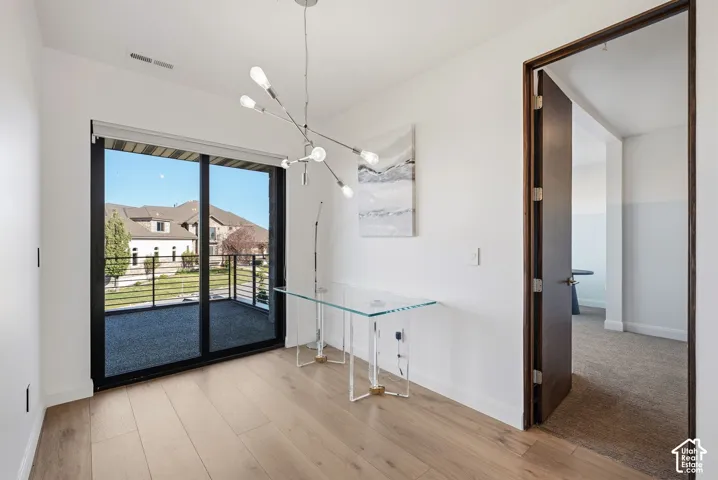 Loft in upper bedroom wing with balcony access