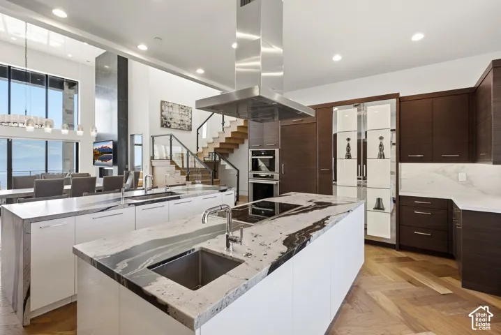 Kitchen with Double islands, thermadore appliances. Grantie couters resembling Brazilian Copacabana Granite with a suede finish