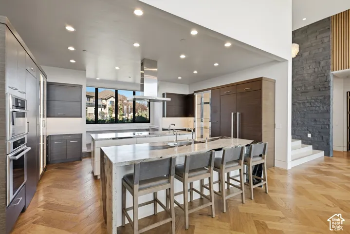 Kitchen with Double islands, thermadore appliances. Grantie couters resembling Brazilian Copacabana Granite with a suede finish