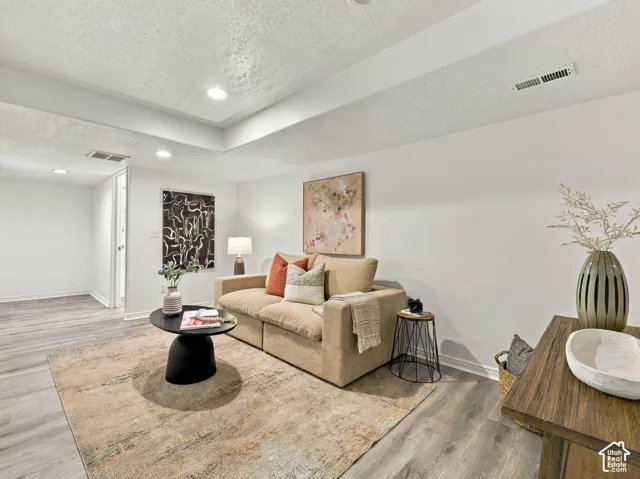 Interior space featuring wood-finish flooring, neutral walls, and recessed lighting