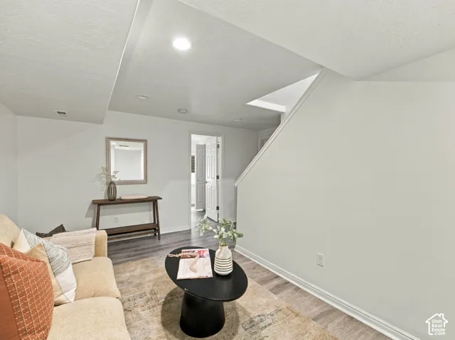 Interior space featuring wood-finish flooring, recessed lighting, and a neutral color palette