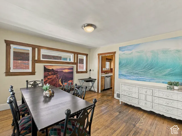 Hardwood flooring, natural wood trim, and multi-pane window casing