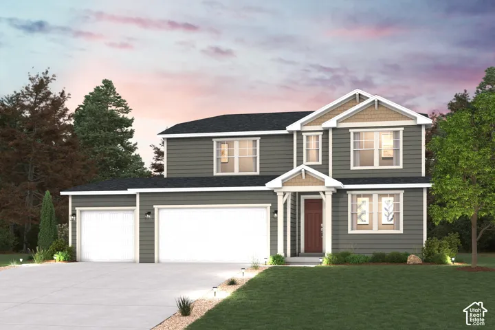 Two-story exterior featuring lap siding, shake-shingle gable accents, a covered front entryway, and an attached three-car garage