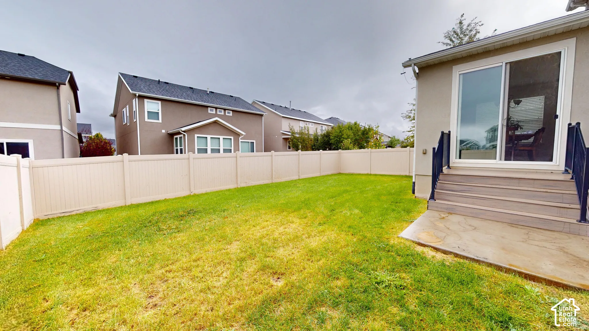 Backyard with updated Trex deck and metal railing